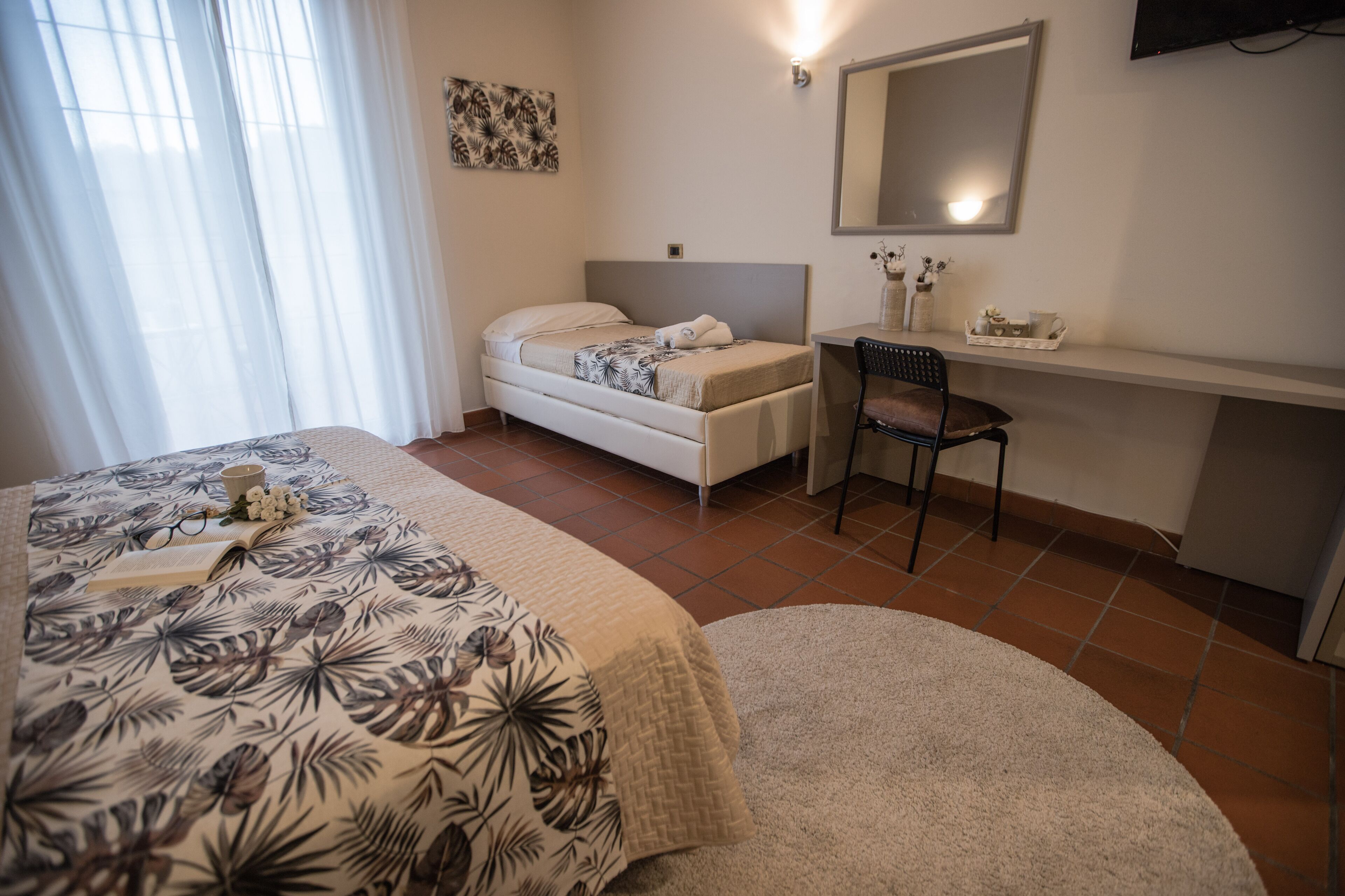 deluxe triple room | desk, laptop workspace, cots/infant beds, rollaway beds