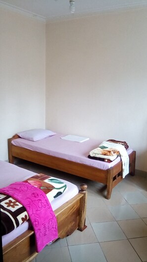 Family Room | Bed sheets - Ifulong cultural tourism homestay (Arusha)