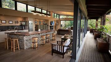 Villa | Living area | 150-cm TV with satellite channels, video library