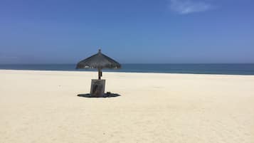 On the beach, sun loungers, beach towels