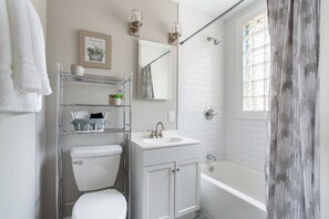 Combined shower/tub, hair dryer, towels, soap