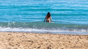 A beach with clear blue water and a sandy shore. - Evdokia Beach Resort (Malevizi)