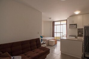 Elite Studio | Living area - Felicitatem Apartments (São Paulo)