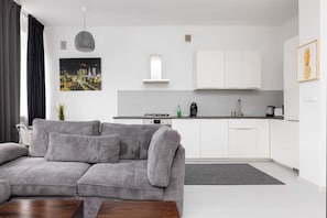 Superior Apartment | Living area | Flat-screen TV