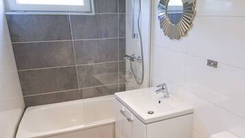 Combined shower/tub, hair dryer, towels, soap