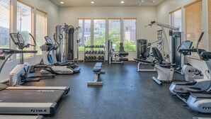 A gym with treadmills, ellipticals, and weight machines. - Beautiful and exceptionally located condo! (Scottsdale)