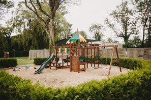 Children's area - Modern apartment, private terrace, quiet location in the historic backyard (Grömitz)