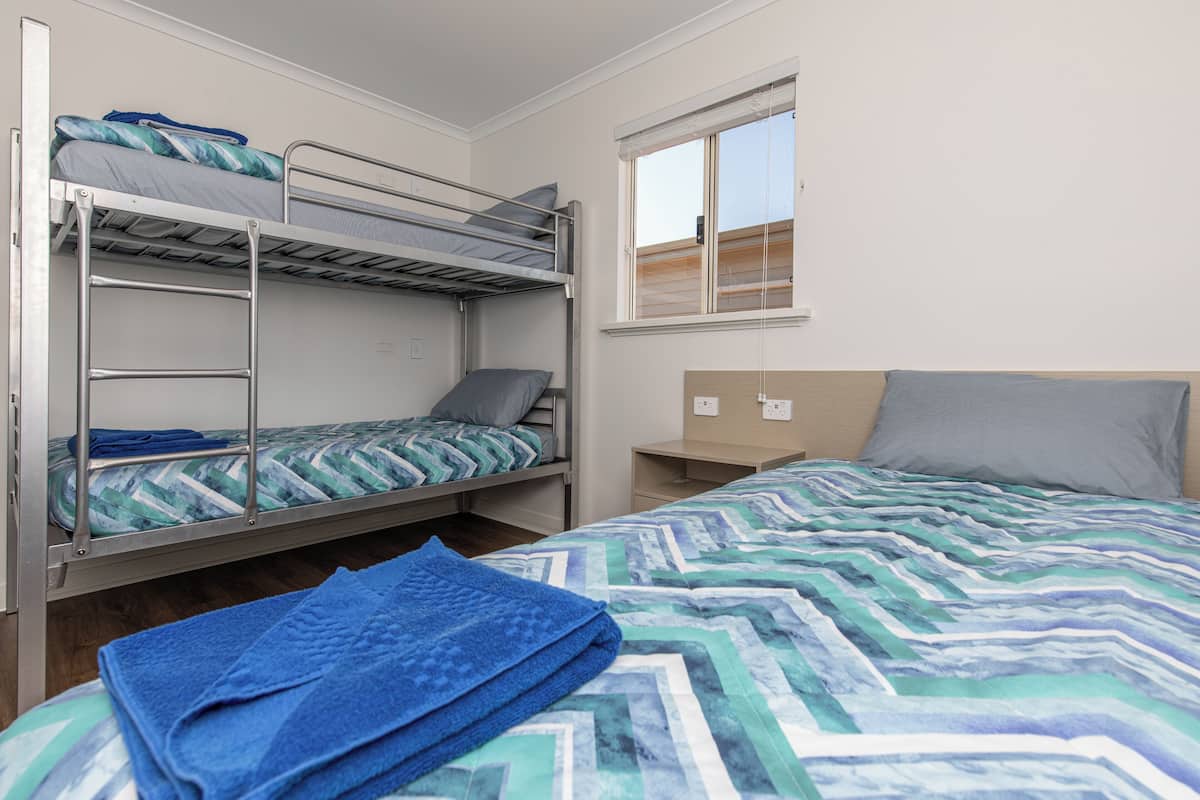2 bedrooms, blackout curtains, iron/ironing board, bed sheets
