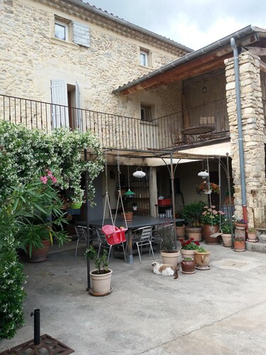 The eighteenth century house is opposite the fortified church of the village.