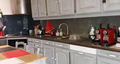 The eighteenth century house is opposite the fortified church of the village.