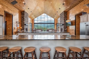 Enjoy cooking in this well-equipped kitchen with a central island stove and ample counter space.