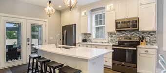 New Home with swim spa, theatre & game room. 1 block to town & close to beach.  