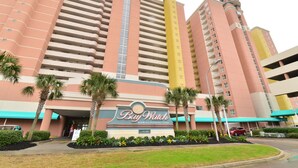 A hotel with a large sign reading "Bay Watch Resort & Conference Center". - Bay Watch Resort 419 - Beautiful North Myrtle Beach Oceanfront 1 Bedroom 1 Bath (North Myrtle Beach)
