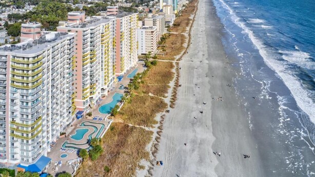 A coastal hotel with multiple high-rise buildings, a beach, and a swimming pool area. - Bay Watch Resort 419 - Beautiful North Myrtle Beach Oceanfront 1 Bedroom 1 Bath (North Myrtle Beach)