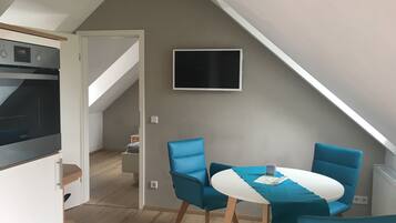 Apartemen Superior | Area keluarga | Smart TV
