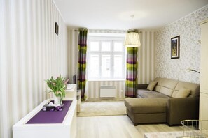 Apartamento, 1 quarto | Área de estar | TV de tela plana