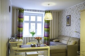 Apartamento, 1 quarto | Área de estar | TV de tela plana