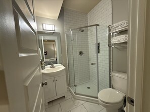 Combined shower/tub, hair dryer, towels, soap