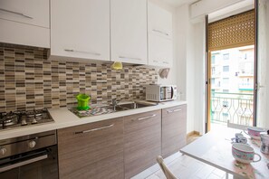 Studio | Private kitchen | Full-sized fridge, microwave, oven, stovetop - Lorenteggio Studio Apt (Milan)