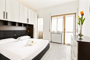 Appartement, 1 slaapkamer | Een strijkplank/strijkijzer, gratis wifi, beddengoed