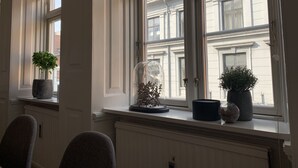 A room with a large window, a radiator, and a chair. - Best Stay Copenhagen Ny Adelgade 7 2nd (Copenhagen)