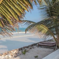On the beach, sun-loungers
