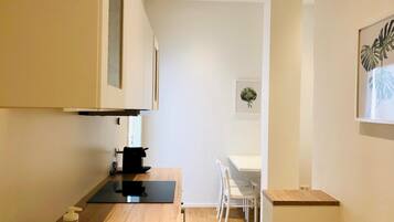 Fridge, electric kettle, cookware/dishes/utensils