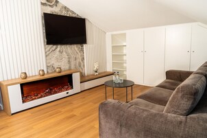 Premium Studio Suite, 1 Bedroom, City View | Living area | Flat-screen TV, Netflix, streaming services