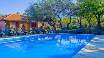 Outdoor pool, open 10:00 AM to 10:00 PM, free pool cabanas