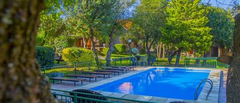 Outdoor pool, open 10:00 AM to 10:00 PM, free cabanas, pool umbrellas