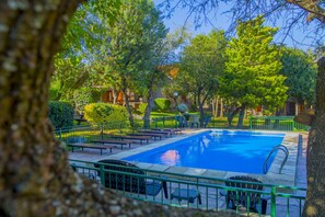 Outdoor pool, open 10:00 AM to 10:00 PM, free cabanas, pool umbrellas