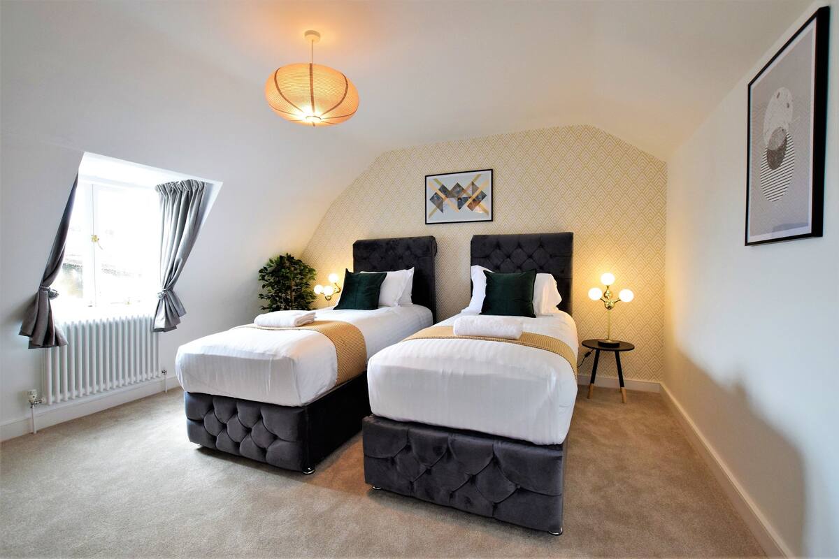 Premium bedding, desk, laptop workspace, iron/ironing board