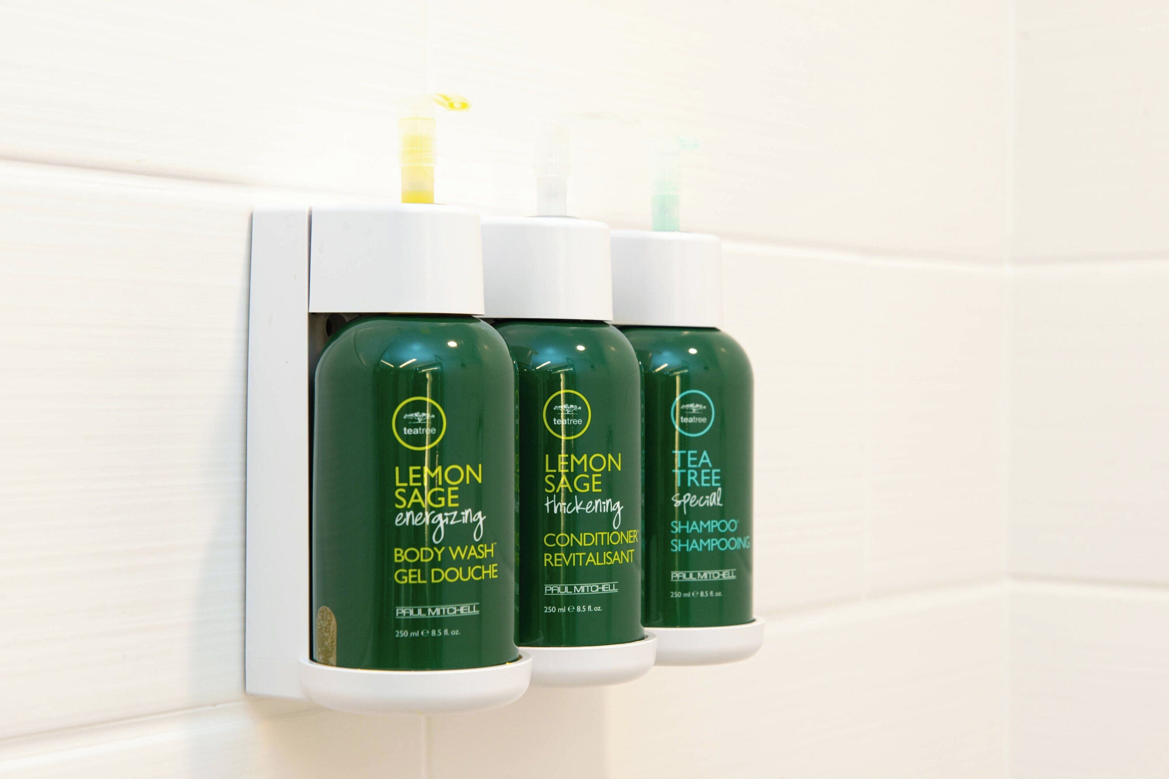 designer toiletries, hair dryer, towels, soap