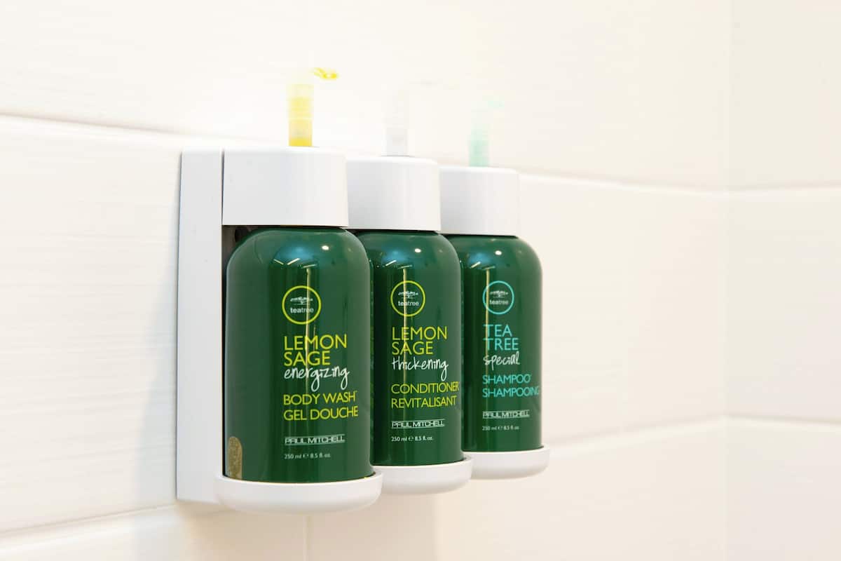 designer toiletries, hair dryer, towels, soap