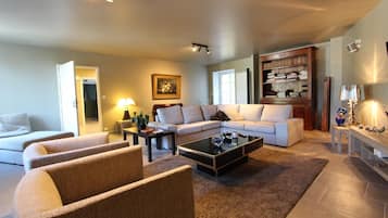 Flat-screen TV, foosball, table tennis, books