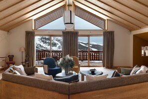 Chalet | Living area | 55-inch Smart TV with satellite channels, TV, toys - Hotel Le Coucou Méribel (Les Allues)