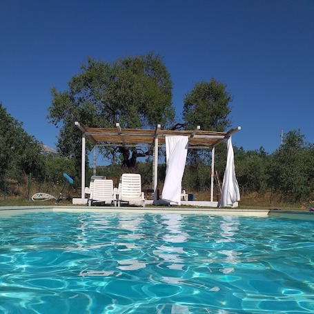 Seasonal outdoor pool, pool umbrellas, pool loungers. Tenuta Don Ballore