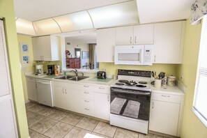 Condo, 2 Bedrooms (0 - No Pets Allowed) | Private kitchen | Fridge, microwave, oven, stovetop - Hibiscus 844 by Distinctive Beach Rentals (Fort Myers Beach)