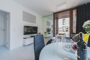 Exclusive Apartment | Living area | Flat-screen TV
