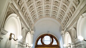 A grand hall with a high, ornate ceiling and large arched windows. - Count Andrassy Luxurious Residence (VI. kerület)
