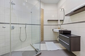 Combined shower/tub, hair dryer, towels, soap