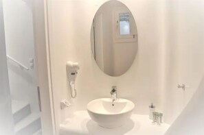 Shower, hair dryer, slippers, towels