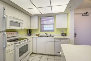 Condo (Estero Island Beach Villas 604) | Private kitchen | Fridge, oven, dining tables