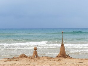 On the beach, sun loungers