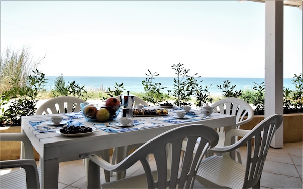 Enjoy a meal al fresco with ocean views from this outdoor dining area.