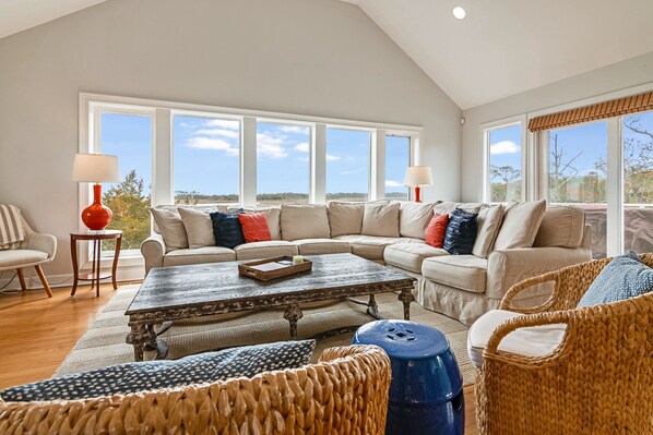 TV, books - Large windows taking in the marsh views on BHI; reverse floor plan and large deck for views! (Bald Head Island)