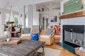 TV, books - Large windows taking in the marsh views on BHI; reverse floor plan and large deck for views! (Bald Head Island)