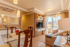 Deluxe Apartment, 2 Bedrooms, Courtyard View | Living area | 32-inch LED TV with satellite channels, TV