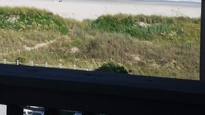 A beach view with a sandy shore, waves, and a clear sky. - North Myrtle Beach Vacation Get Away (North Myrtle Beach)