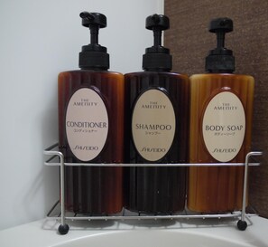 Three bottles of The Amenity brand products on a metal shelf. - Hotel Route-Inn Grand Ota Ekimae (Ota)